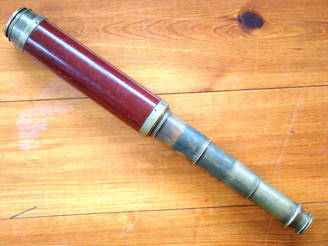 A very fine English three-draw telescope with mahogany barrel circa 1800-1825